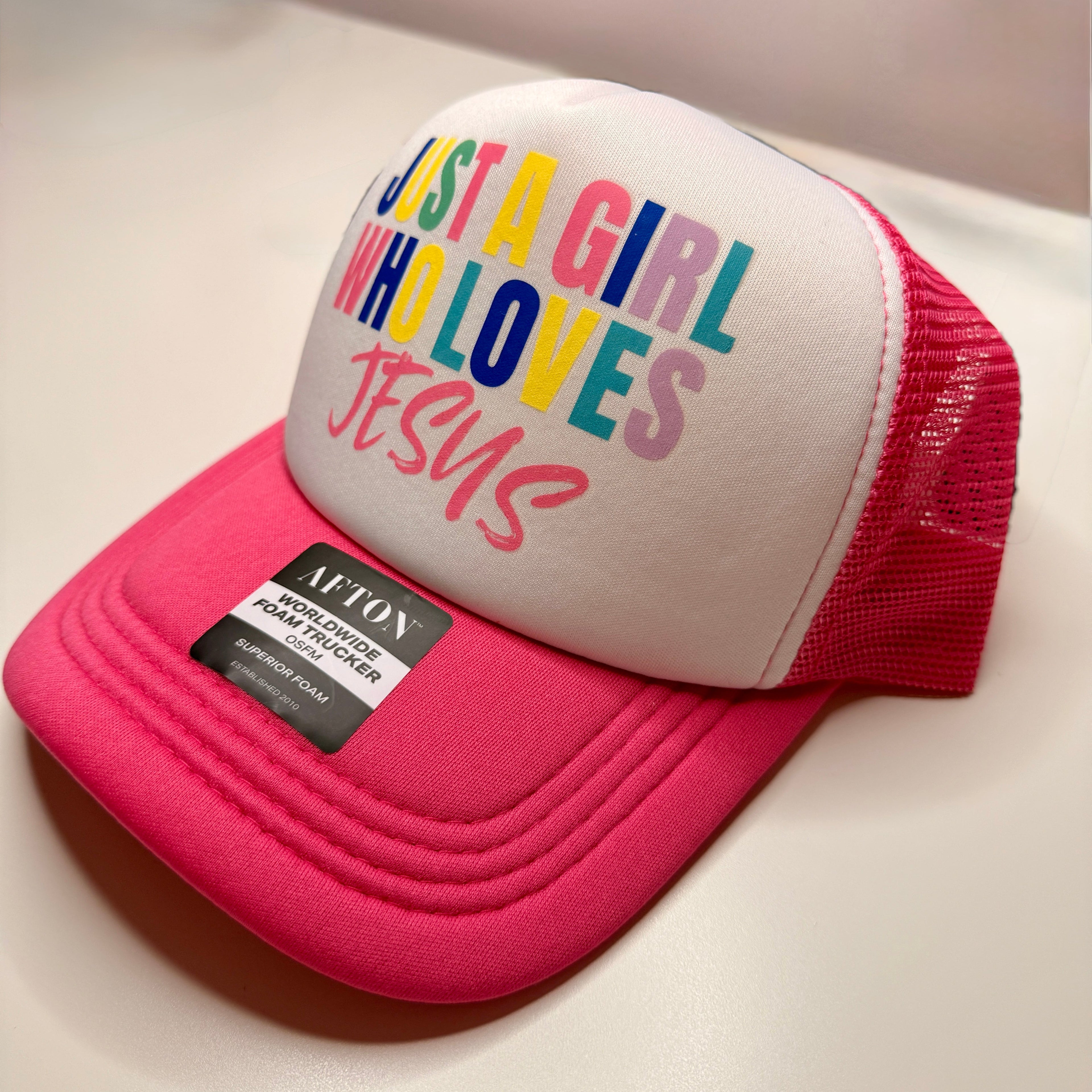Just a Girl Who Loves Jesus™ | AFTON Pink Foam Trucker Hat