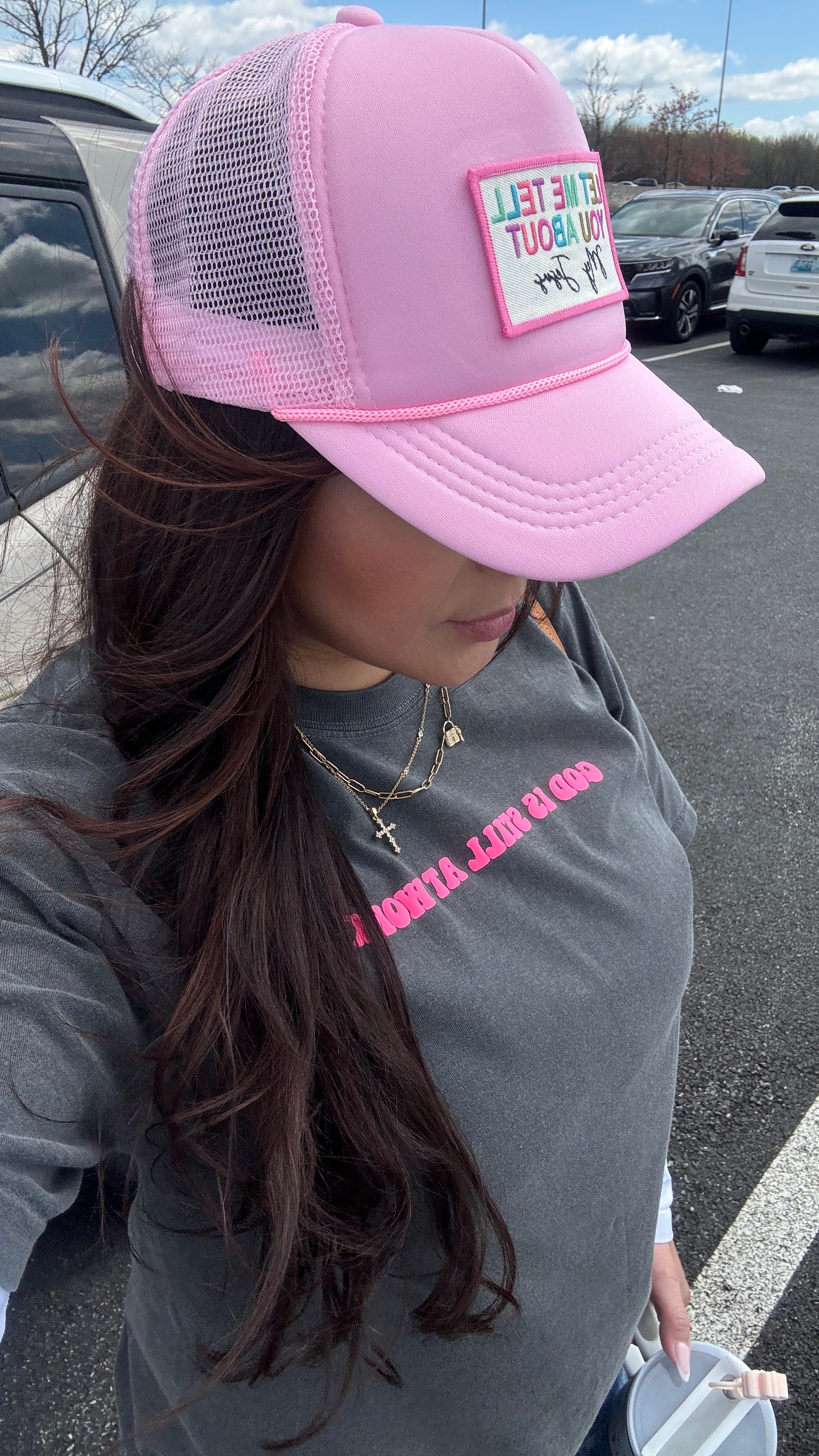 Pink “Let me tell you about my Jesus” Trucker Hat