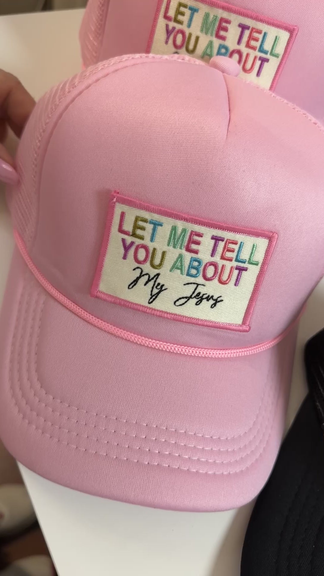 Pink “Let me tell you about my Jesus” Trucker Hat